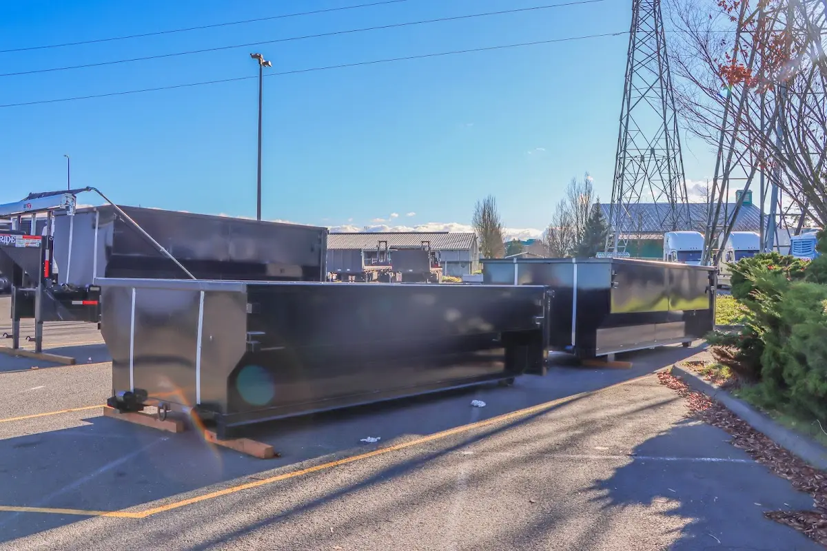 Roll-off dumpster ready for waste disposal at job site for Concrete Dumpster Rental in Bar Harbor